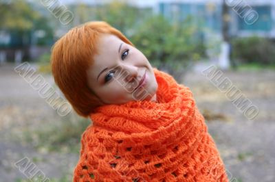young red-haired woman in red scarf