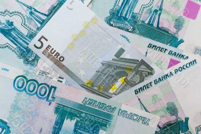 Euros and Russian roubles banknotes