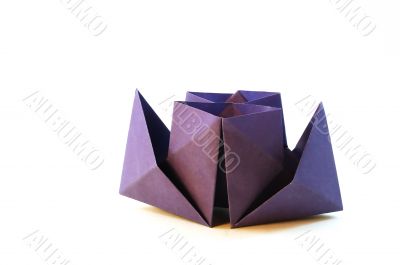 Dark blue paper toy-ship on a white background.