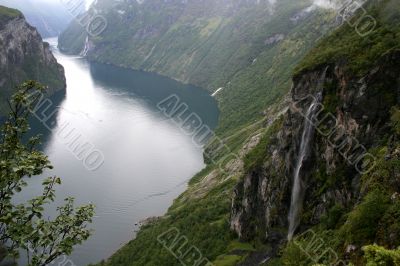 view of Geiranger fjord Norway with waterfall