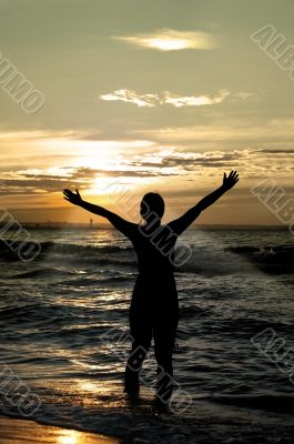 worshipper against incredible summer sunset