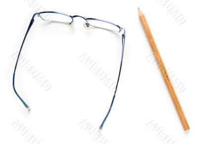 Glasses and pencil