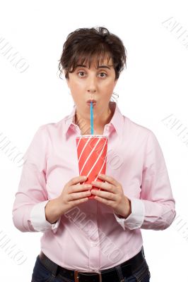 Surprised young woman drinking