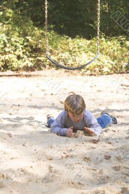 Boy Playing in Sand