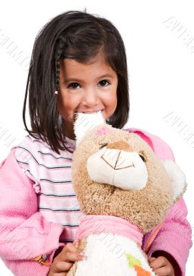 little girl playing with her teddy