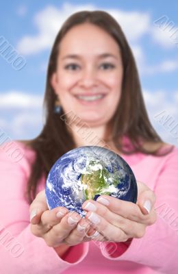 girl holding globe
