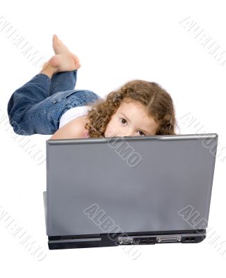 beautiful little girl on a laptop