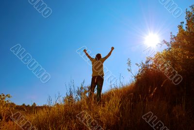 young man raising his hands