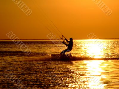 Silhouette of a kitesurf on a gulf on a sunset 2