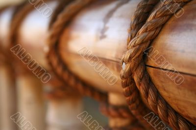 Rope, nail and wooden surface