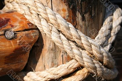 Rope, nail and wooden surface