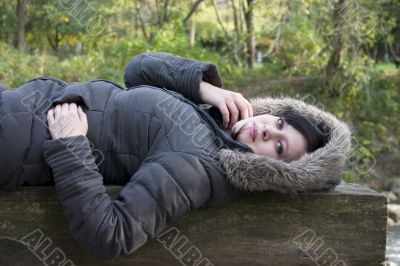 Chanelle lying on wood