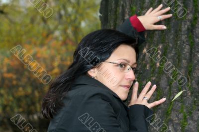 young woman with black hair in glasses, autumn shot