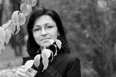 young woman with black hair in glasses, autumn shot