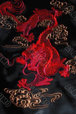 Red dragon on the black atlas