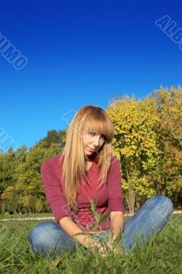 blond relaxing on the grass
