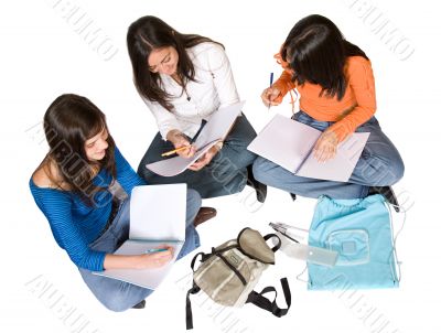 beautiful students studying on the floor