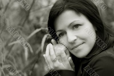 woman and apple in autumn park