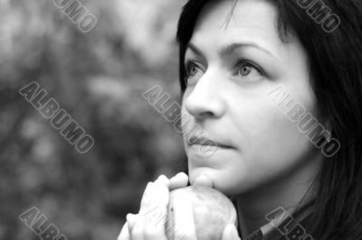 woman and apple in autumn park