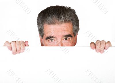 senior business man peeping over