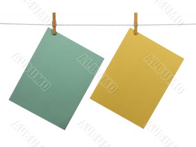 Blank paper sheets on a clothes line (+clipping path)