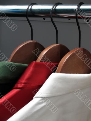 Stylish shirts on hangers
