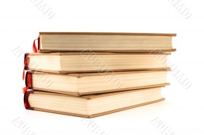 Four hardcover books on white background