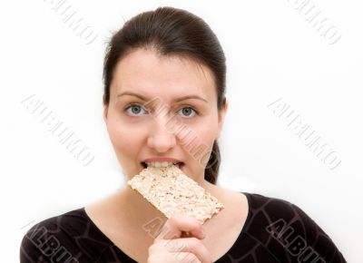 woman eats bread