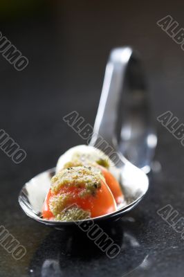 Spoon filled with small amuse