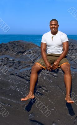 On rock by sea