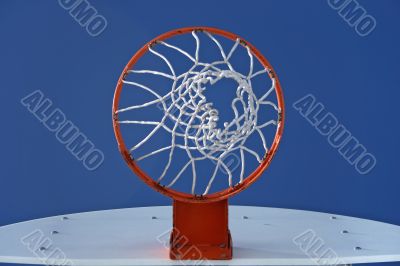 Orange basketball hoop and the blue sky
