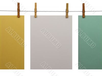 Colorful paper sheets on a clothes line (+clipping path)
