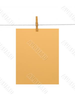 Orange paper sheet on a clothes line (+2 clipping paths)