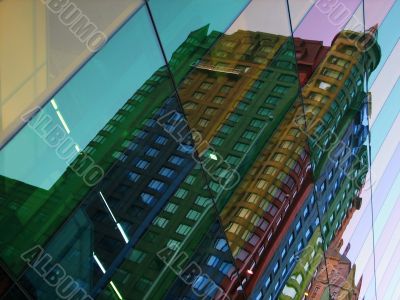 Building reflections in colorful glass windows