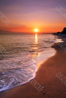 Deserted beach at sunset