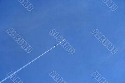 Jet airplane going up in the blue sky