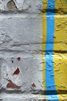 Graffiti detail on a peeling painted wall