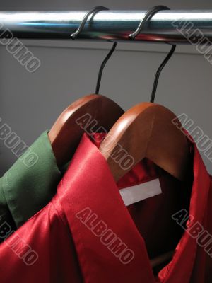Red and green shirts in a closet