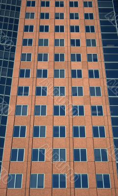 Windows of a terracotta-colored building