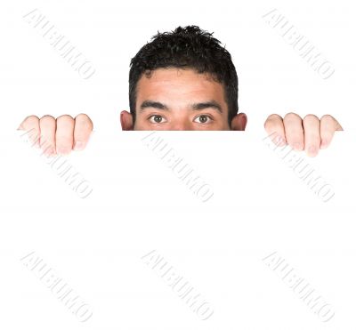 casual guy looking over white card