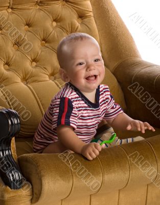 baby in big armchair