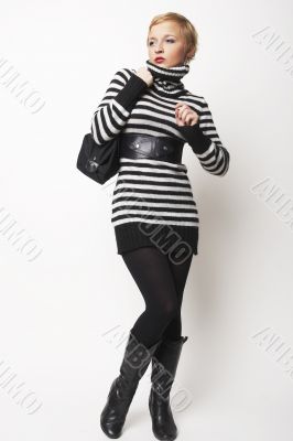 Nice blondgirl standing with black bag