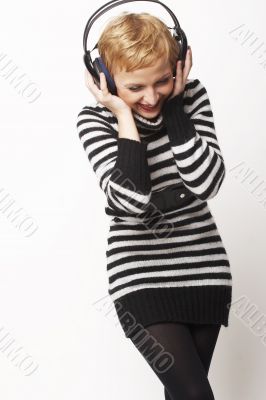 portrait of young girl with headphones, wearing dress