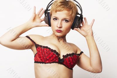 Close up portrait of young and attractive party girl with headph