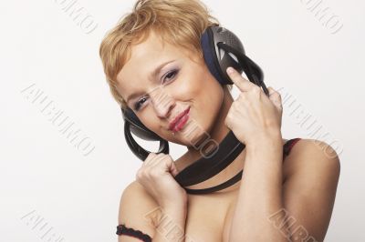 Close up portrait of young and attractive party girl with headph