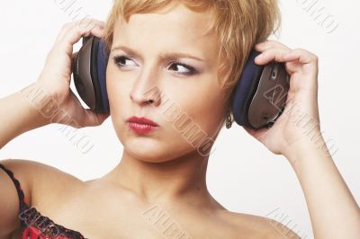 Close up portrait of young and attractive party girl with headph
