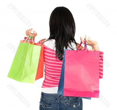 girl in pink holding shopping bags