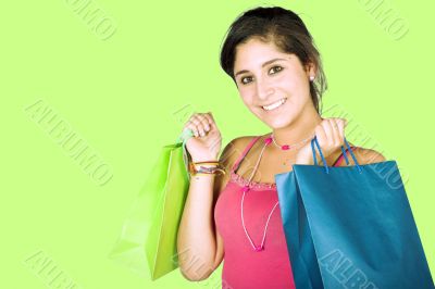 girl with shopping bags over green