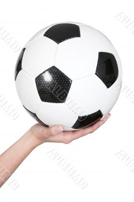 female hand holding a soccer ball
