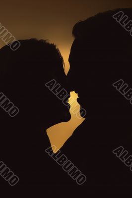 beautiful silhouette of a couple enjoying the sunset